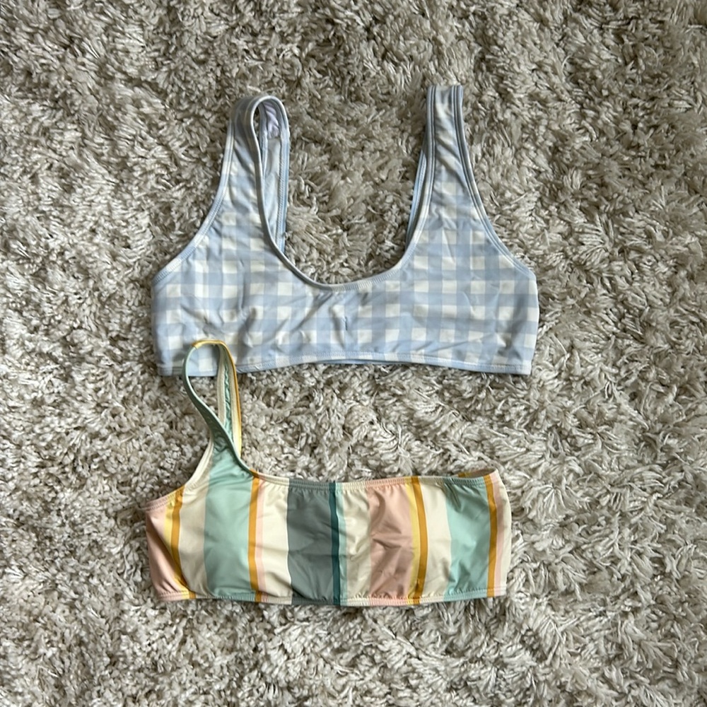 2  ladies bathing suit tops.
